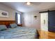 Comfortable bedroom featuring a barn door leading to the bathroom and a plush bed at 5846 Edgewood Trace Blvd, Indianapolis, IN 46239