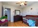 bedroom with hardwood floor, crib and dino accents on the wall at 5846 Edgewood Trace Blvd, Indianapolis, IN 46239