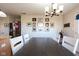 Dining area features a table with chairs, decor on the wall, and wood flooring at 5846 Edgewood Trace Blvd, Indianapolis, IN 46239