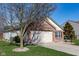 This lovely home boasts a well-maintained yard, attached garage, and charming brick and siding exterior at 5846 Edgewood Trace Blvd, Indianapolis, IN 46239
