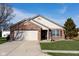 Charming one-story home features brick and siding, a two-car garage, and a well-maintained front yard at 5846 Edgewood Trace Blvd, Indianapolis, IN 46239