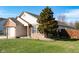 This cozy home showcases a well-kept lawn, complemented by charming brick and siding details at 5846 Edgewood Trace Blvd, Indianapolis, IN 46239