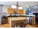 Modern kitchen with granite countertops, stainless steel appliances, and stylish lighting fixtures at 5846 Edgewood Trace Blvd, Indianapolis, IN 46239