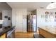Kitchen featuring stainless steel refrigerator, granite counters, and wooden cabinets at 5846 Edgewood Trace Blvd, Indianapolis, IN 46239