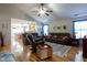 Cozy living room with an open floor plan, hardwood floors, and plenty of natural light at 5846 Edgewood Trace Blvd, Indianapolis, IN 46239