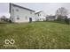Large green backyard with a fire pit, grass and fenced yard at 639 Rocky Meadow Dr, Greenwood, IN 46143