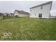 Large green backyard with a fire pit, grass and fenced yard at 639 Rocky Meadow Dr, Greenwood, IN 46143