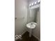 Small bathroom featuring a pedestal sink, large mirror, and neutral paint at 639 Rocky Meadow Dr, Greenwood, IN 46143