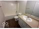 This bathroom features a tub-shower combo, toilet, vanity, and mirror at 639 Rocky Meadow Dr, Greenwood, IN 46143