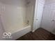 This bathroom features a tub-shower combo and vinyl flooring at 639 Rocky Meadow Dr, Greenwood, IN 46143