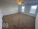 This bedroom features neutral paint, carpet, a ceiling fan, and two windows at 639 Rocky Meadow Dr, Greenwood, IN 46143