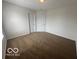 This bedroom features neutral walls, carpet, and two doors at 639 Rocky Meadow Dr, Greenwood, IN 46143
