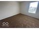 This bedroom features neutral walls, carpet, and a window at 639 Rocky Meadow Dr, Greenwood, IN 46143