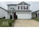 Charming two-story home with gray siding, red shutters, and a well-maintained front yard at 639 Rocky Meadow Dr, Greenwood, IN 46143