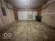 Two car garage interior with concrete floors and white garage door at 639 Rocky Meadow Dr, Greenwood, IN 46143