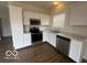 Bright kitchen featuring white cabinetry, stainless steel appliances and sink, and plenty of natural light at 639 Rocky Meadow Dr, Greenwood, IN 46143