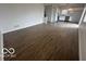 Spacious open-concept living and dining area with plank flooring and natural light from a window at 639 Rocky Meadow Dr, Greenwood, IN 46143