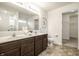 Bathroom vanity features double sinks, stone countertops, and a spacious walk-in closet at 647 Albermarle Dr, Pittsboro, IN 46167