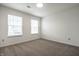 Cozy bedroom boasting natural light from two windows and neutral decor throughout at 647 Albermarle Dr, Pittsboro, IN 46167