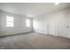 Spacious bedroom with neutral carpet and two closets at 647 Albermarle Dr, Pittsboro, IN 46167