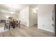 Bright dining area with modern chandelier, table and chairs adjacent to the living room at 647 Albermarle Dr, Pittsboro, IN 46167