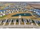 Panoramic aerial view of the neighborhood with homes surrounding a pond with fountain, ideal location at 6630 Overlander Ln, Whitestown, IN 46075