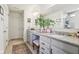 Granite counters and double sinks highlight this bathroom with ample storage space and neutral walls and flooring at 6630 Overlander Ln, Whitestown, IN 46075