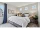 Bright bedroom features neutral walls, and plush bed with stylish decor and modern touches at 6630 Overlander Ln, Whitestown, IN 46075