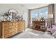 Bright bedroom with large windows, wood dresser, decorative mirror, and stylish furnishings at 6630 Overlander Ln, Whitestown, IN 46075