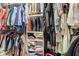 Walk-in closet featuring organized clothing racks and shelves with a variety of apparel and accessories at 6630 Overlander Ln, Whitestown, IN 46075