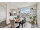 Dining room with natural light and views, featuring wood floors and neutral decor at 6630 Overlander Ln, Whitestown, IN 46075