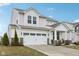 Charming two-story home featuring a two-car garage, covered porch and well-maintained landscaping at 6630 Overlander Ln, Whitestown, IN 46075