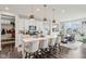 A modern kitchen with a large center island, stylish pendant lighting, and stainless steel appliances at 6630 Overlander Ln, Whitestown, IN 46075