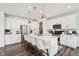 Bright kitchen featuring white cabinets, a center island with seating, and stainless steel appliances at 6630 Overlander Ln, Whitestown, IN 46075