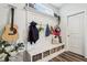 Well-organized mudroom with built-in bench, storage baskets, coat hooks, and decorative touches at 6630 Overlander Ln, Whitestown, IN 46075