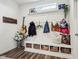 Well-organized mudroom with built-in bench, storage baskets, coat hooks, and decor at 6630 Overlander Ln, Whitestown, IN 46075