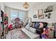Bright playroom featuring a large couch, toys, and lots of natural light at 6630 Overlander Ln, Whitestown, IN 46075