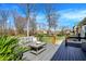Large back deck with ample seating and views of the backyard at 6820 W Forest Brook Dr, Fountaintown, IN 46130