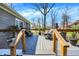 Inviting back deck featuring modern railing, outdoor seating, and stylish decor at 6820 W Forest Brook Dr, Fountaintown, IN 46130