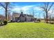 Large backyard, featuring green grass and a deck at 6820 W Forest Brook Dr, Fountaintown, IN 46130
