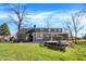 Spacious backyard with a well-maintained lawn and a large deck, perfect for outdoor entertaining at 6820 W Forest Brook Dr, Fountaintown, IN 46130
