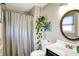 Bathroom featuring a shower, toilet, and stylish decor, including a hanging plant at 6820 W Forest Brook Dr, Fountaintown, IN 46130