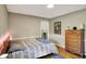 Bedroom with neutral paint, wood floors, and hallway access at 6820 W Forest Brook Dr, Fountaintown, IN 46130