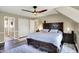 Well-appointed bedroom featuring a king bed, closet, and modern ceiling fan at 6820 W Forest Brook Dr, Fountaintown, IN 46130