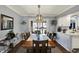Elegant dining room with a large table, stylish lighting, and beautiful trim work, perfect for gatherings at 6820 W Forest Brook Dr, Fountaintown, IN 46130