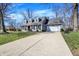 Beautiful two story home featuring a long driveway with basketball hoop at 6820 W Forest Brook Dr, Fountaintown, IN 46130