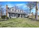 Charming gray two-story home with black shutters, dormer windows, and a well-manicured lawn at 6820 W Forest Brook Dr, Fountaintown, IN 46130