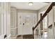 Bright foyer with a white door, decorative glass, staircase and neutral walls at 6820 W Forest Brook Dr, Fountaintown, IN 46130