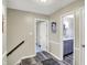 Inviting hallway featuring stylish flooring, neutral walls, and doorways leading to various rooms at 6820 W Forest Brook Dr, Fountaintown, IN 46130