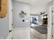 Inviting hallway leads to living room featuring a decorative 'Love Always Wins' sign and modern decor at 6820 W Forest Brook Dr, Fountaintown, IN 46130